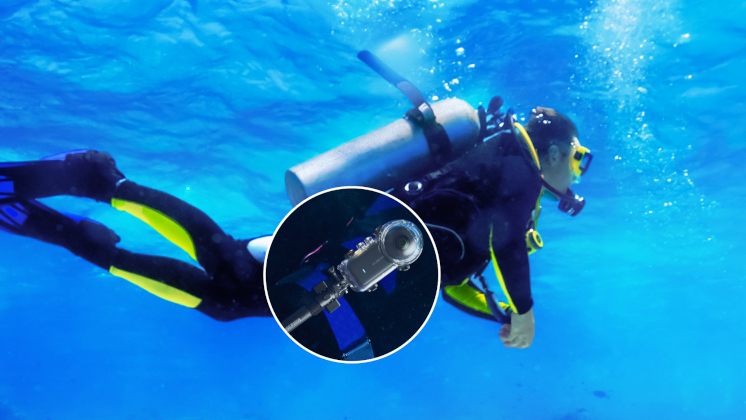 This image shows how The Magnetic Selfie Stick Holster can be attached to your waist belt whilst diving to give you quick access to your camera.
